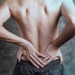 back pain treatment with a massage gun