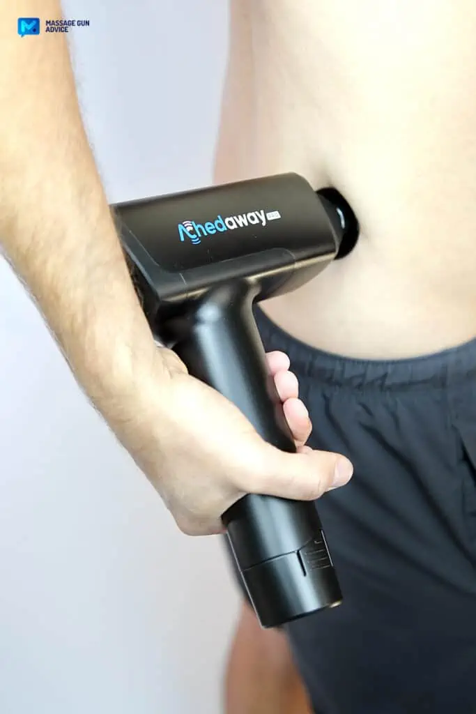 What Toxins Are Released After Massage? Demystifying Detoxification 7 massage after a workout: man holding massage gun on lower back pain