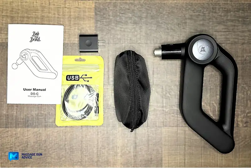 Bob and Brad D5 Pro Review: An Affordable Massage Gun For DOMs 9 Bob and Brad D5 Pro: carrying case contents displayed on a table