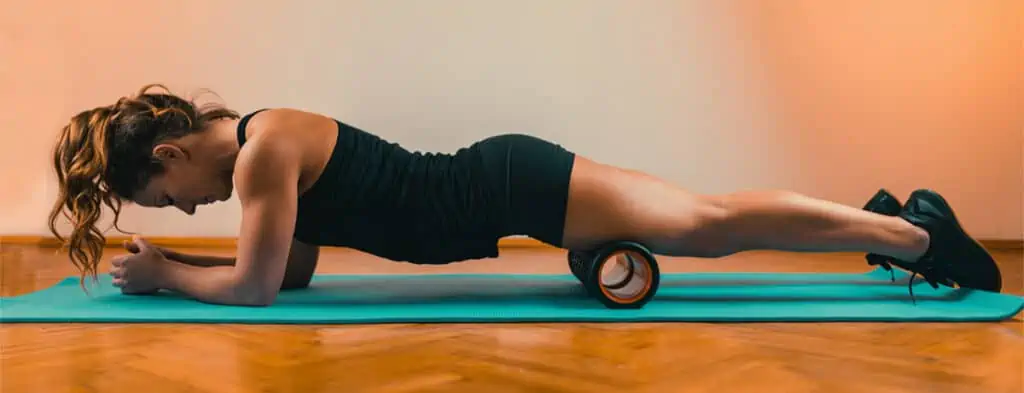 Complete Guide to Compression Therapy: What It Is and How It Benefits You 13 Benefits Of Using A Foam Roller-an athlete using a high density foam roller on her legs