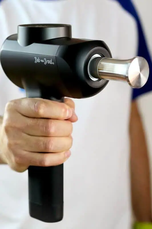 Bob And Brad X6 Pro:, Man holding a  Massage Gun