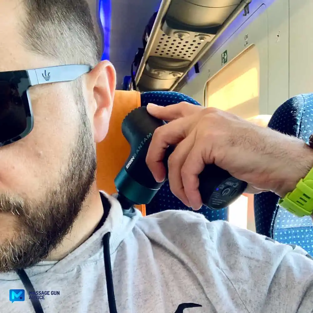 Can You Bring A Massage Gun On A Plane TSA? High-Flying Muscle Massager 1 can you bring a massage gun on a plane tsa? christian hemsworth holding Ekrin Bantam