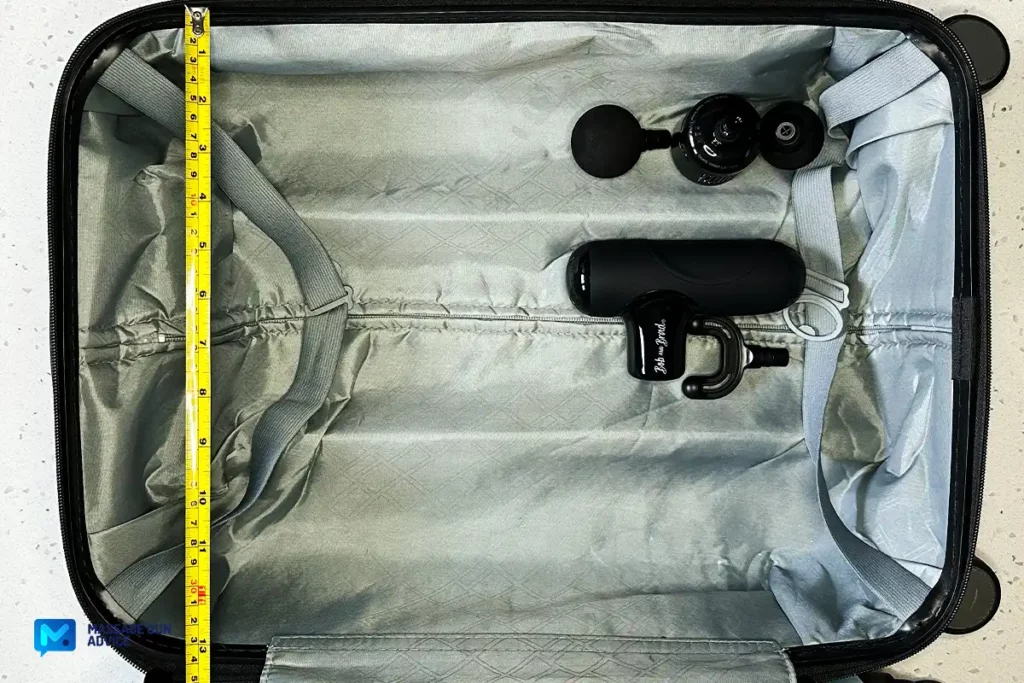 Bob And Brad Q2 Pro: Portable Hot & Cold Therapy 25 Carry On Luggage open. Inside The Q2 Pro Mini Massage Gun laying beside its attachments