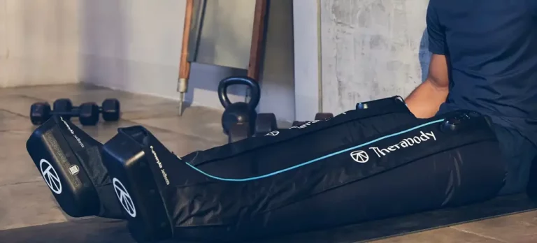 a man using Compression Therapy Boots Therabody