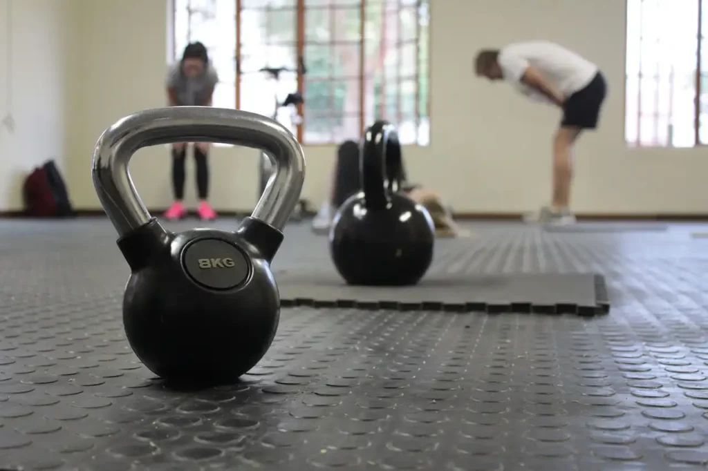 Complete Guide to Compression Therapy: What It Is and How It Benefits You 8 Kettle Bell and in the background people training at a gym_592905 1280 Image By Zoe Animation Studio