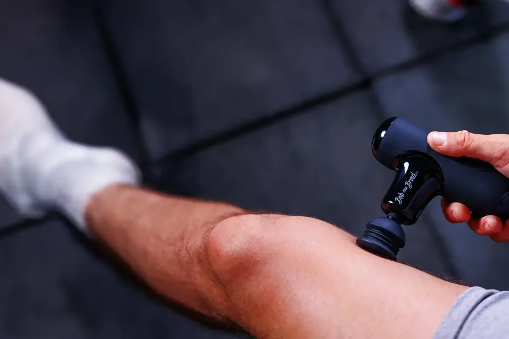 Bob And Brad Q2 Pro: Portable Hot & Cold Therapy 42 Man Using bob and brad Q2 Pro Mini Massage Gun On His left Leg