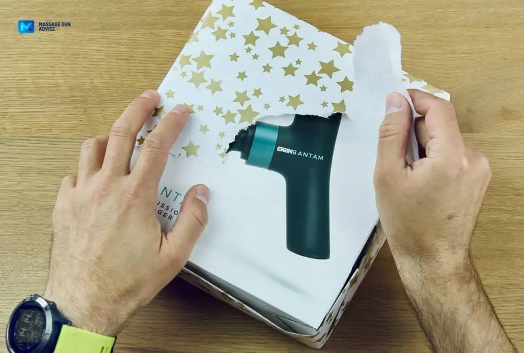 Ultimate Guide to Charging Your Massage Gun: Best Practices and Essential Tips 19 Ekrin Bantam mini massage gun gift being unwrapped.