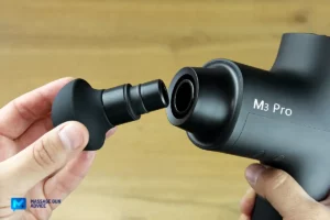 Massage Gun Not Turning On? Troubleshooting Tips That Work 15 fingers holding massage gun head opposite Opove M3 Pro Head Mounting System Push In