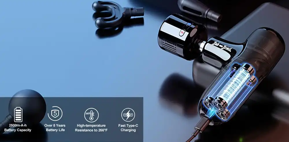 Bob And Brad Q2 Pro: Portable Hot & Cold Therapy 37 bob and brad Q2 Pro Mini Massage Gun with charging cable attached while laying on a black notebook. Battery specs are shown on the bottom left corner of the photo.