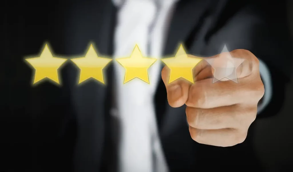 8 Key Factors to Consider Before Buying a Sports Massager 5 floating 4 stars for product review with a business man behind