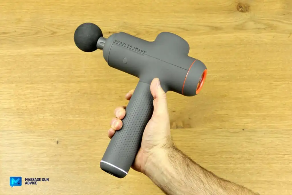 Sharper Image Massager Review – Good on the Outside but Only So-So In Performance 16 sharper image power percussion deep tissue massage held by a hand