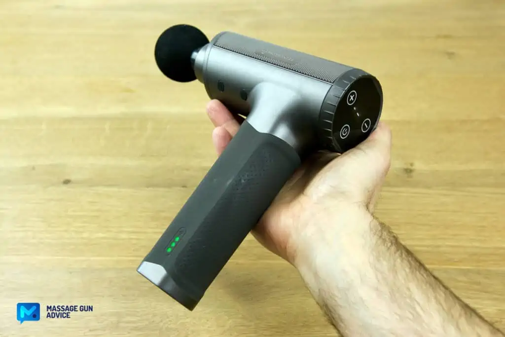 Sharper Image Massager Review – Good on the Outside but Only So-So In Performance 33 taotronics tt-pca004 mid-size massage gun laying on a man's hand